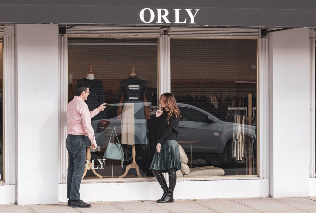 The co-owners of Orly standing in front of their store. 