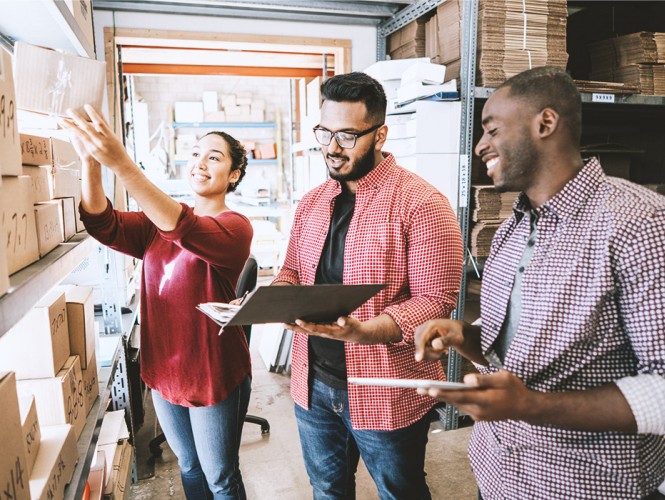 Three people working at their small business.