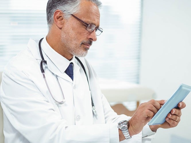Image of a doctor on a tablet.