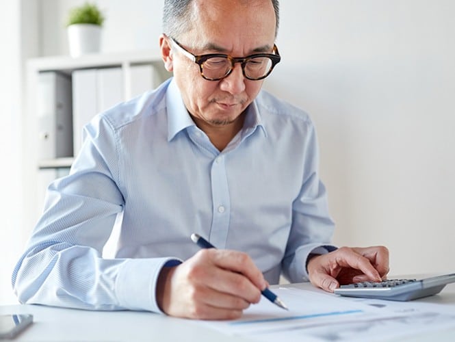 Image of a man reviewing a document. 